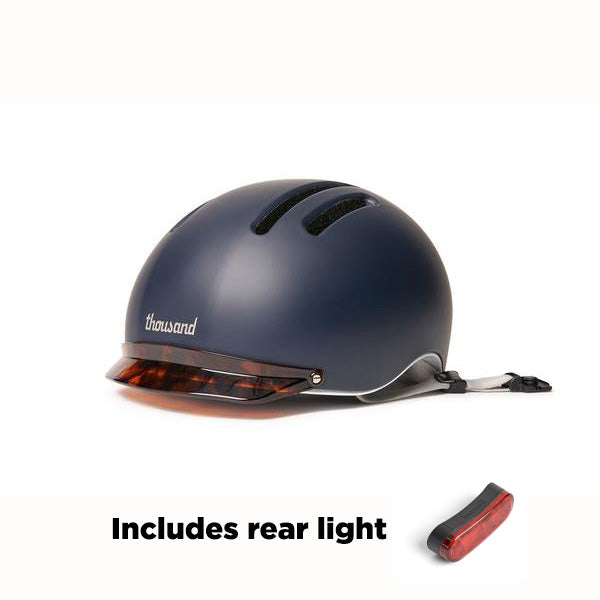 Navy helmet by Thousand with MIPS