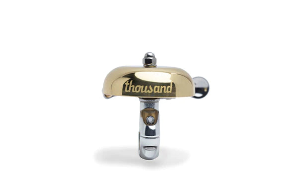 Side view of brass bell by Thousand