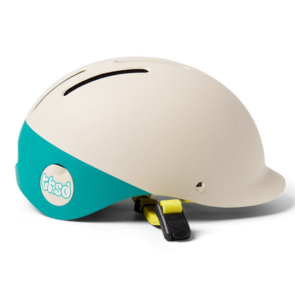 Beige Thousand helmet with teal strap and visible brand logo on a white background
