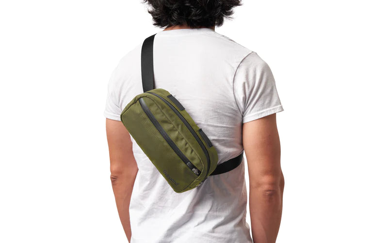Man wearing the handlebar bag, adjusted for slinging over the shoulder
